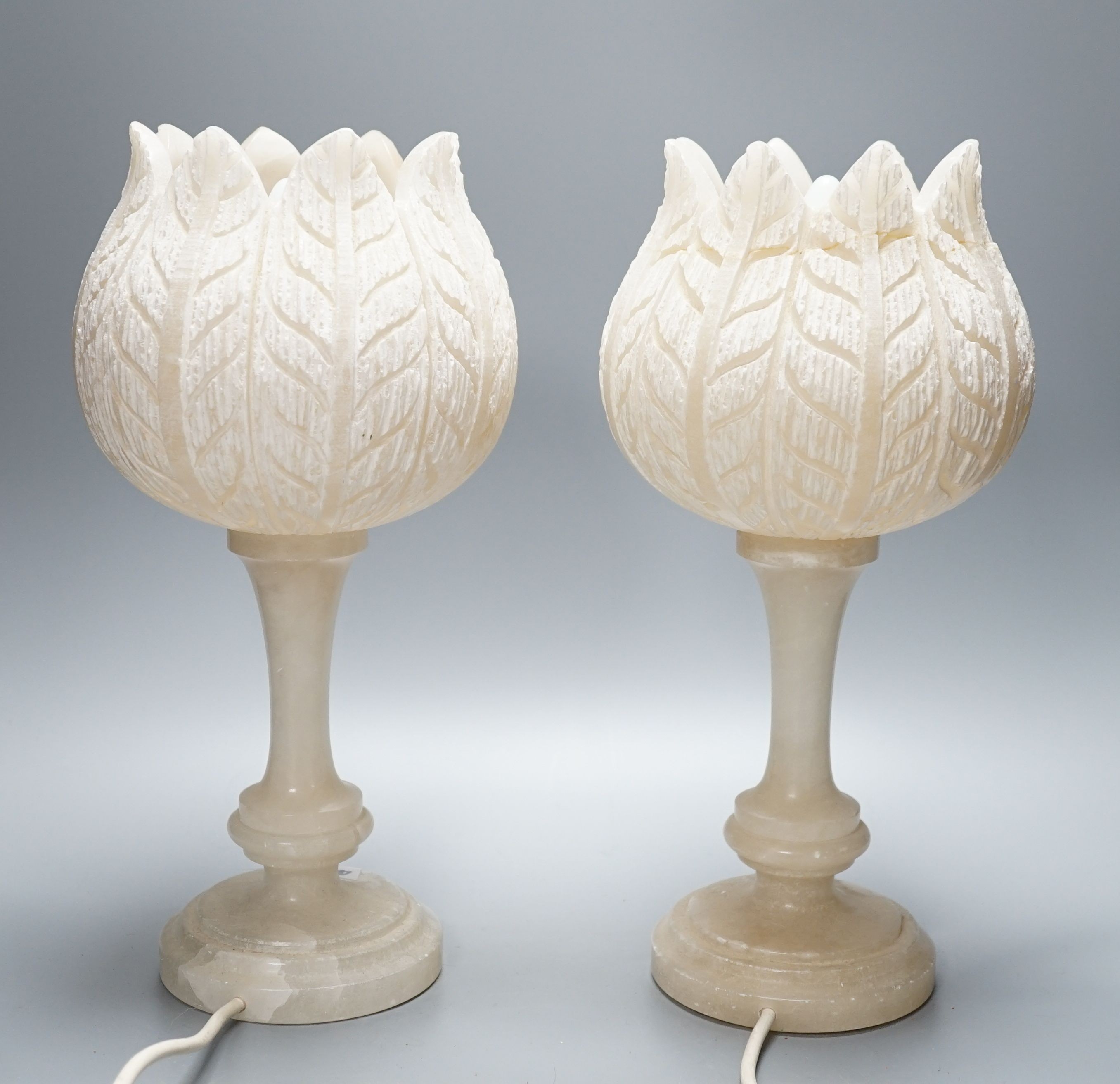 Pair of carved alabaster tulip lamps 38cm